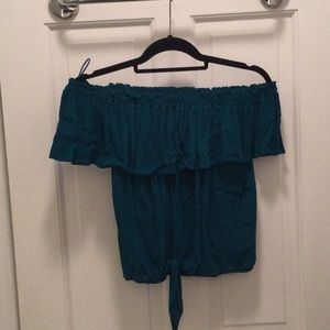 Teal off the shoulder express top with tie front. Elastic and ruffle detail